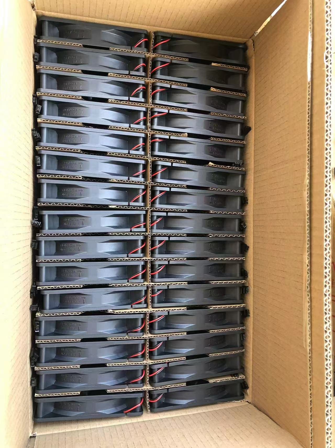 Cooling fans packed with cardboard dividers in a carton